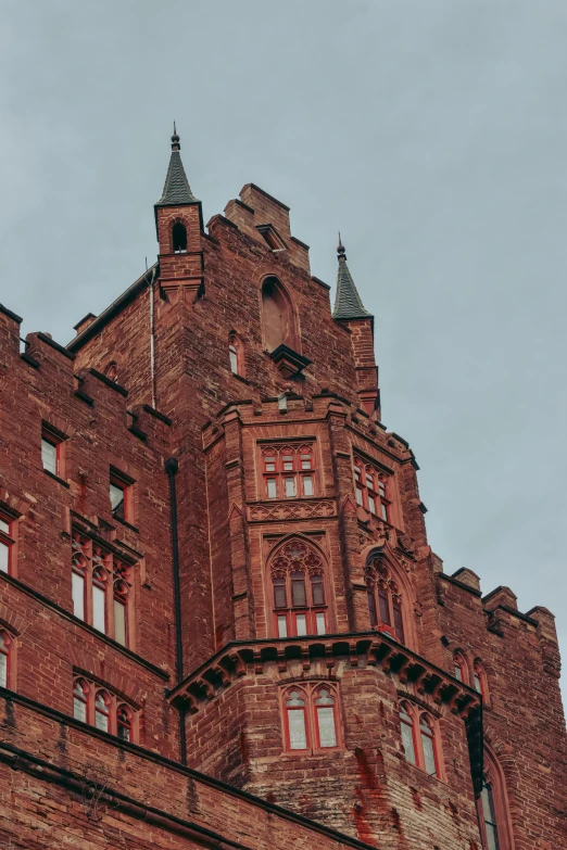 tall brick building with two very high clock towers