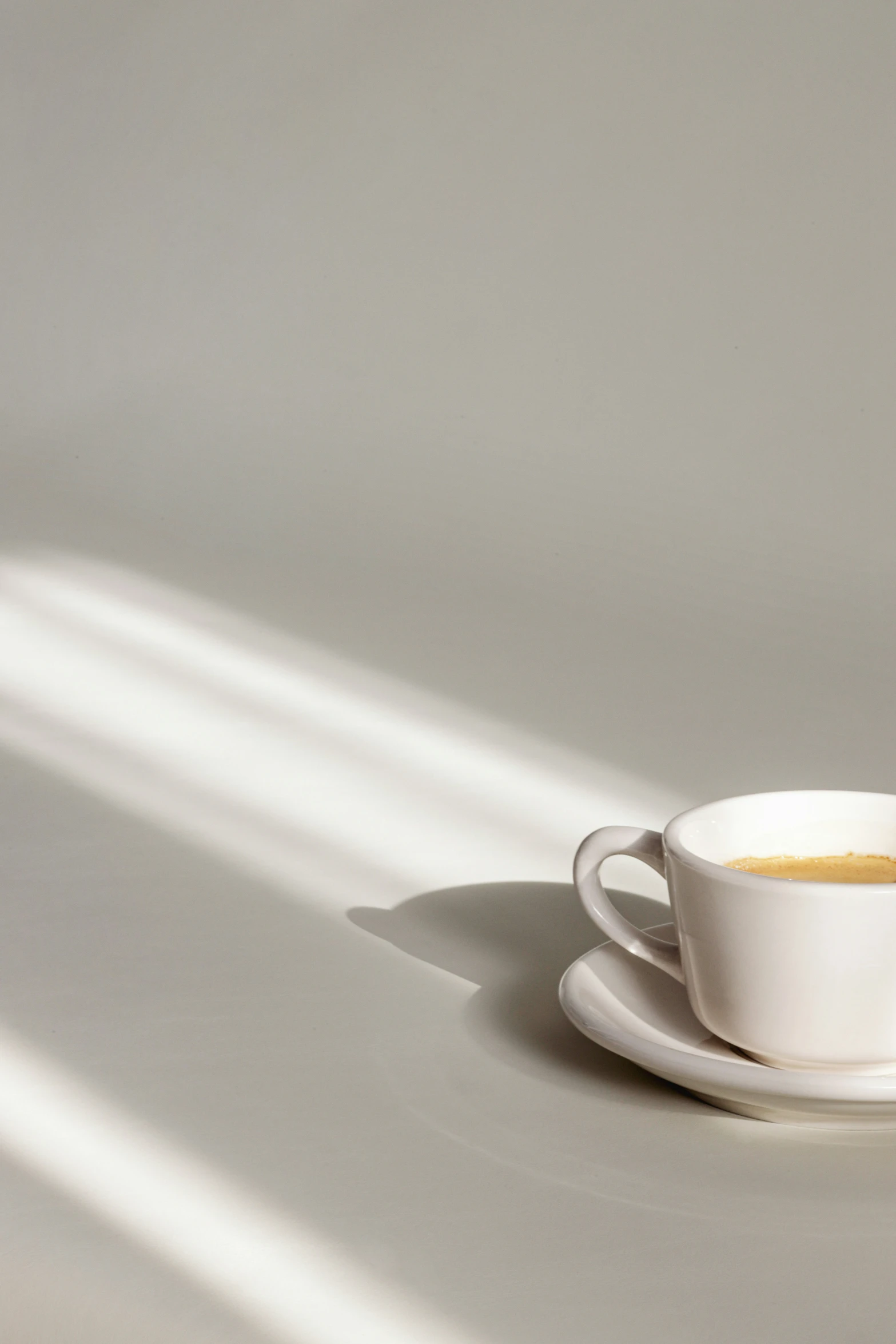 an open cup of coffee sitting on top of a saucer