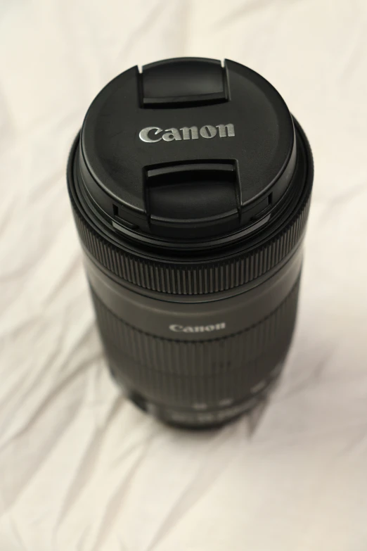 this camera lens is attached to the side of its case