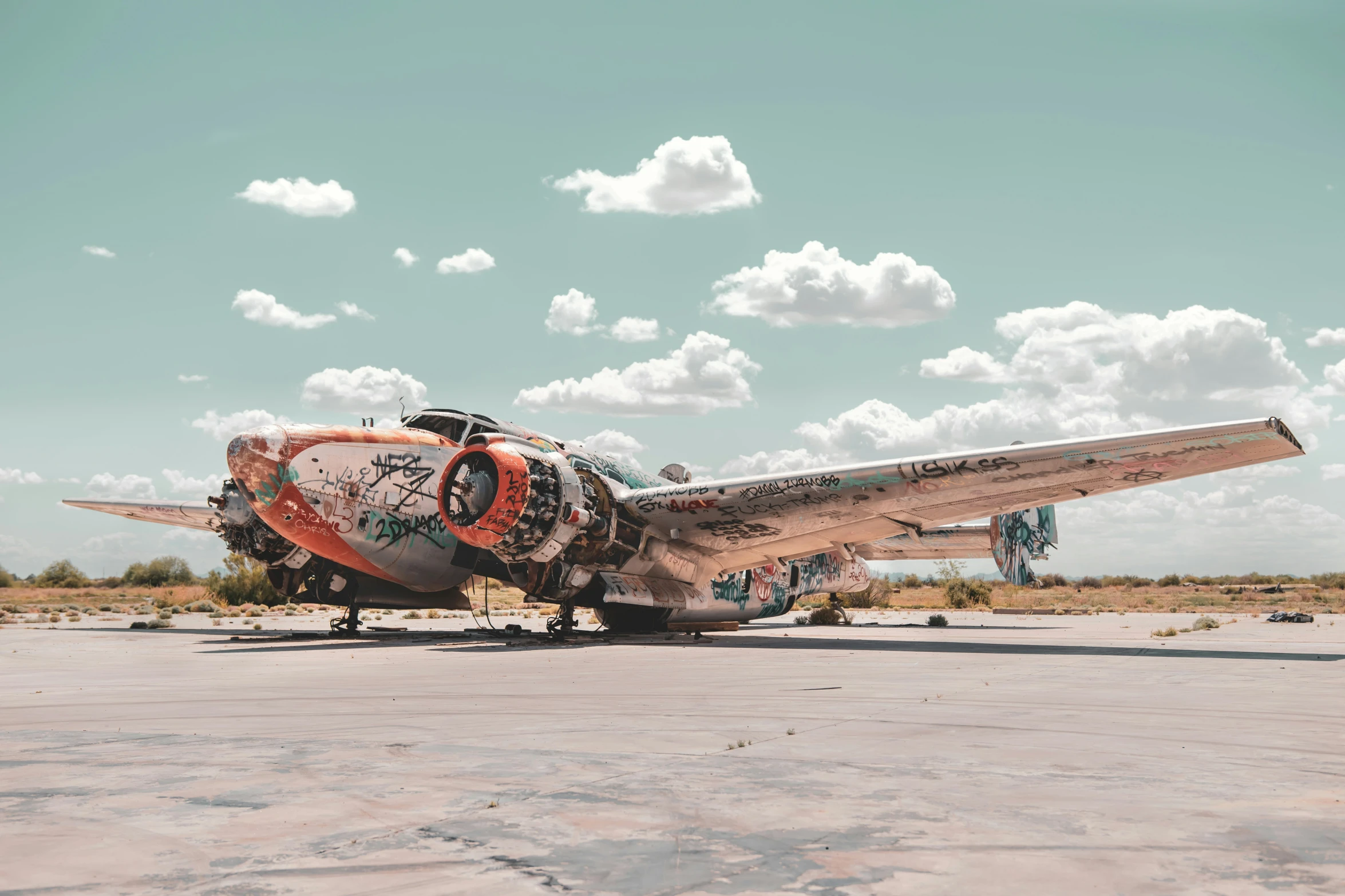 the old airplane has been painted and graffitiized