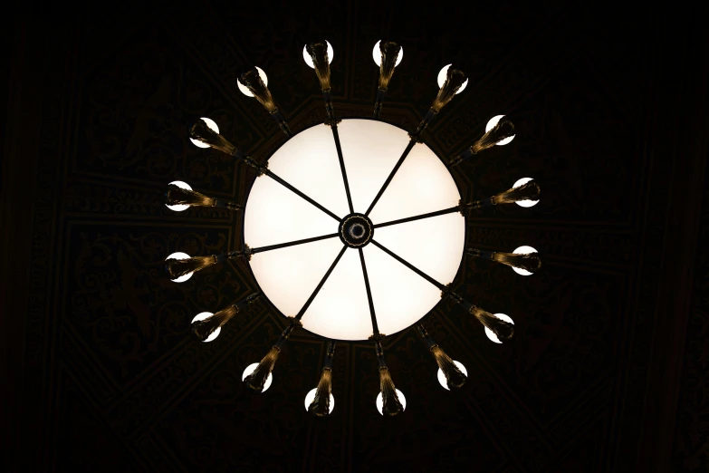 a ceiling with a large circular window in the center of it