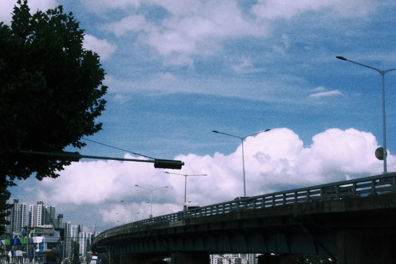 a highway bridge is seen beneath a cloudy sky
