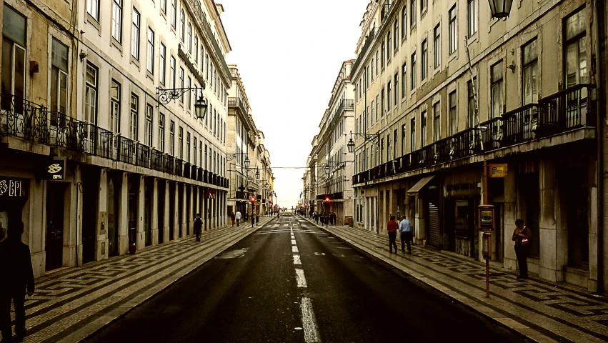 a long empty street in an older city