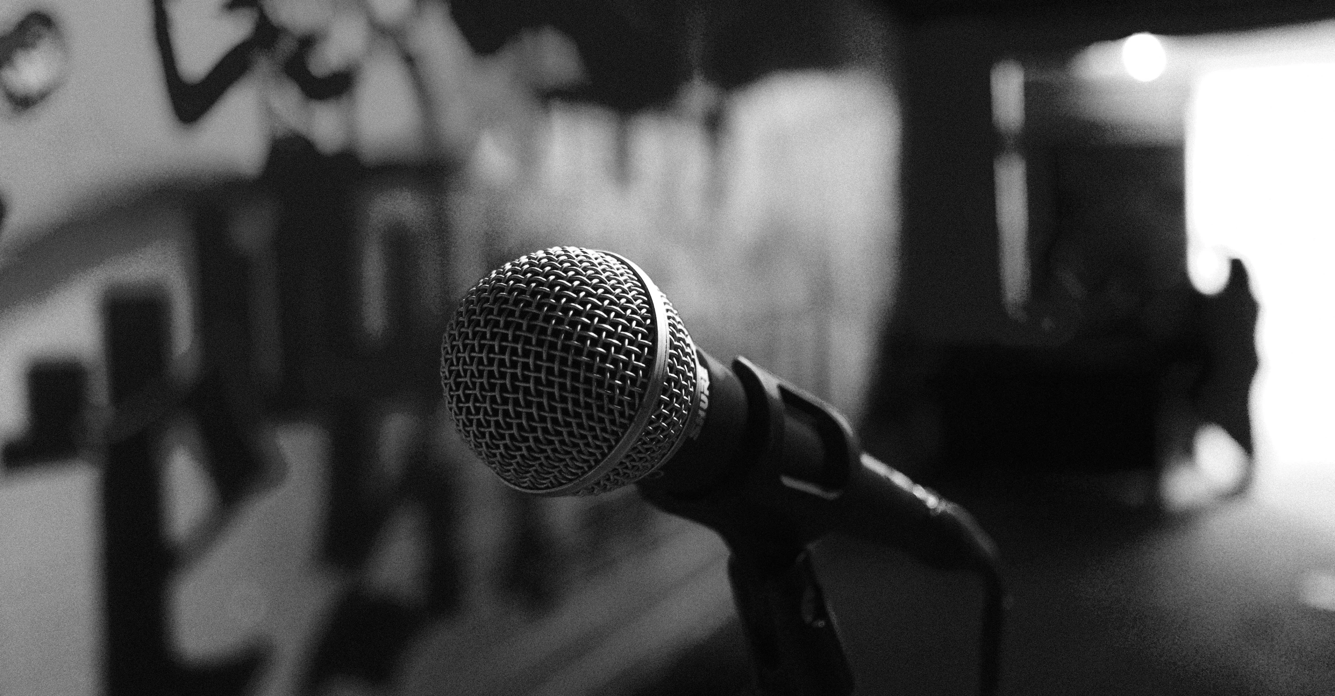 a microphone is in front of a wall of notes