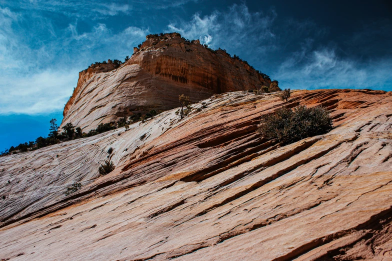 an image of a rock mountain climber looking up