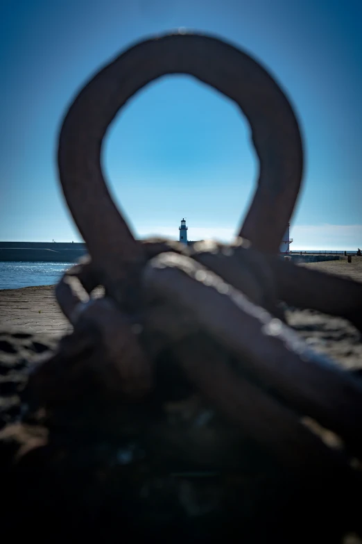 two rings are tied together in front of a lighthouse