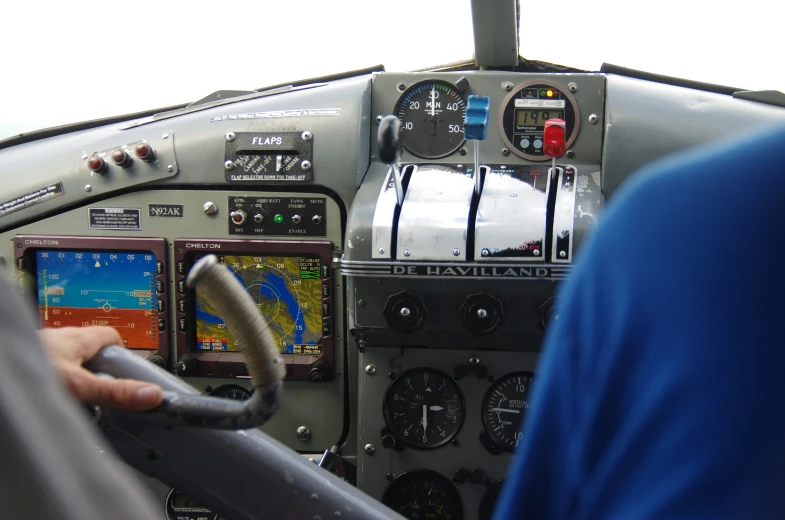 a po looking at the cockpit of a jet fighter