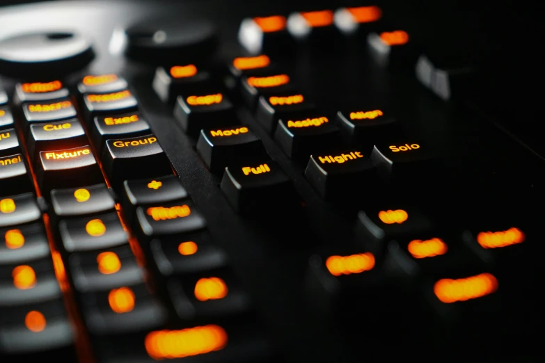 close up s of an orange glow on a black keyboard