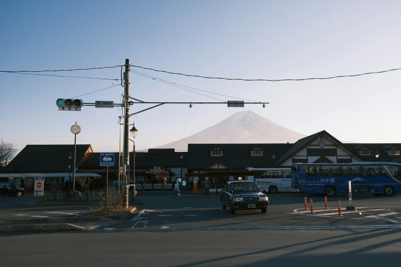 a stop light is shown in front of a business