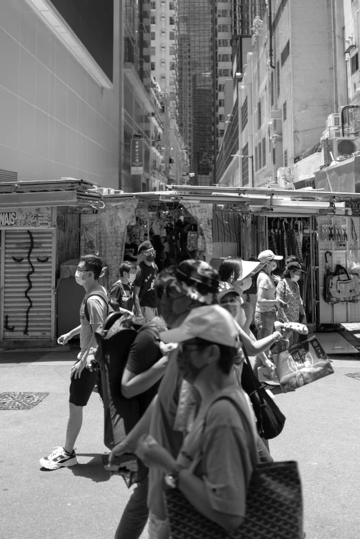 people standing in the city on the sidewalk