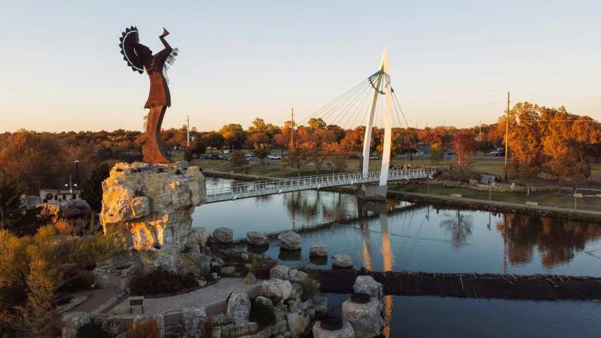 an elaborate fountain is pictured on top of a hill