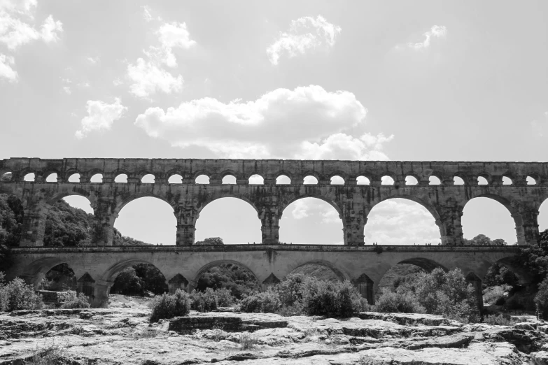 black and white po of an old building with arches in it