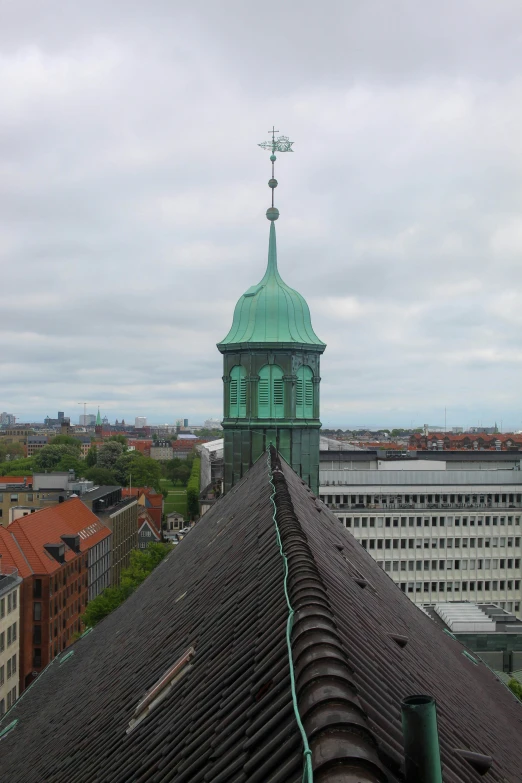 a large building with a green top on top of it