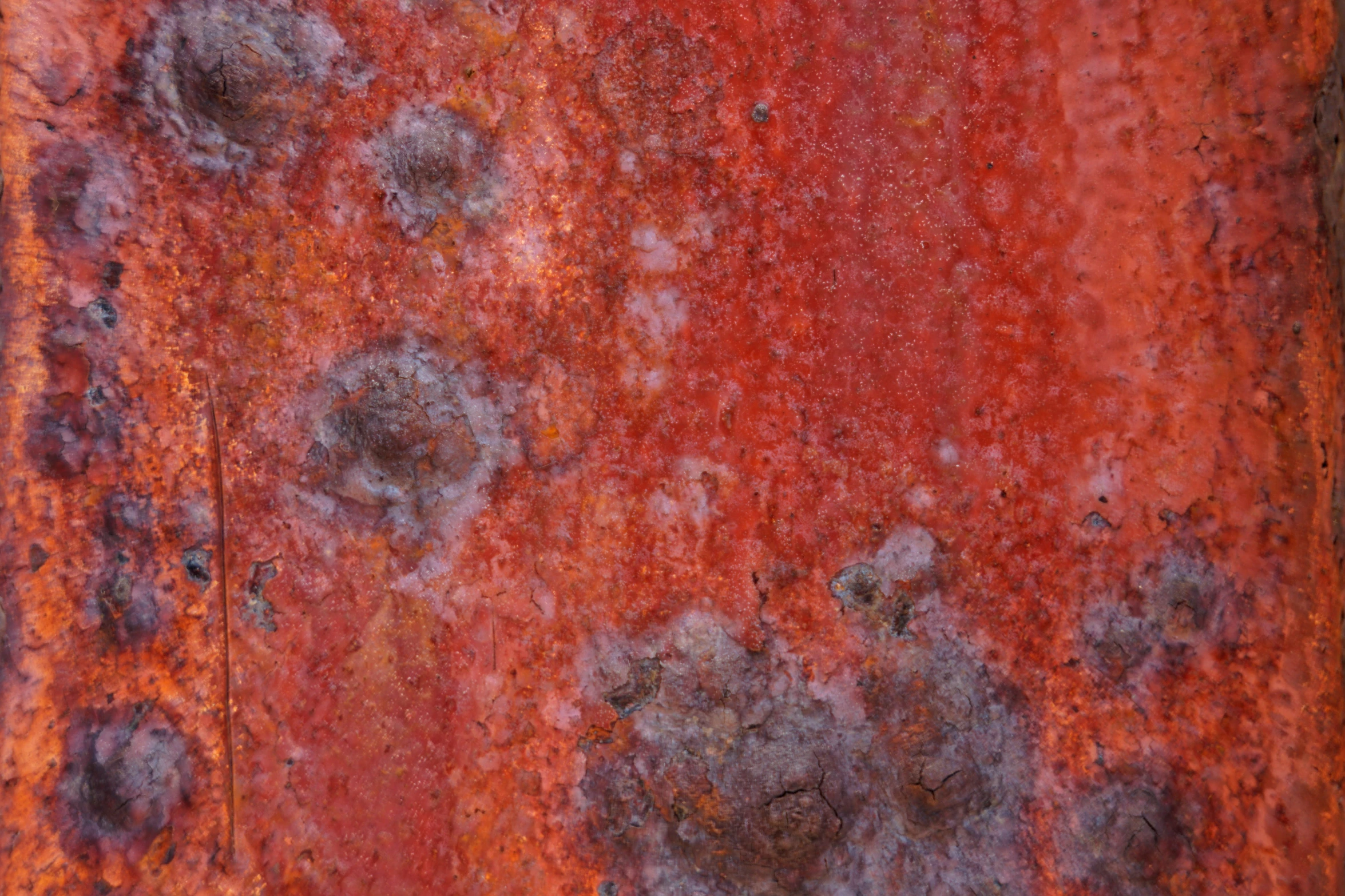 a rusty orange background with some little specks