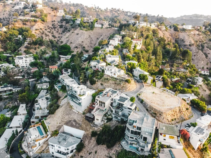 an aerial view of the hillside surrounding a small town