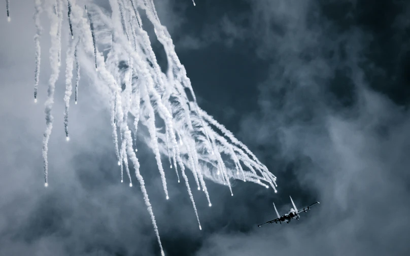 snow falls are seen in this pograph of a plane flying above