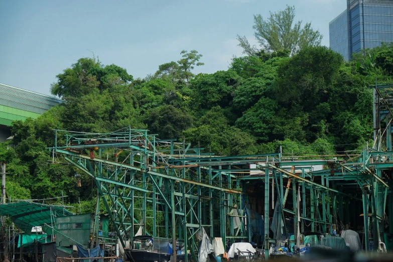 a group of people standing by some metal structures