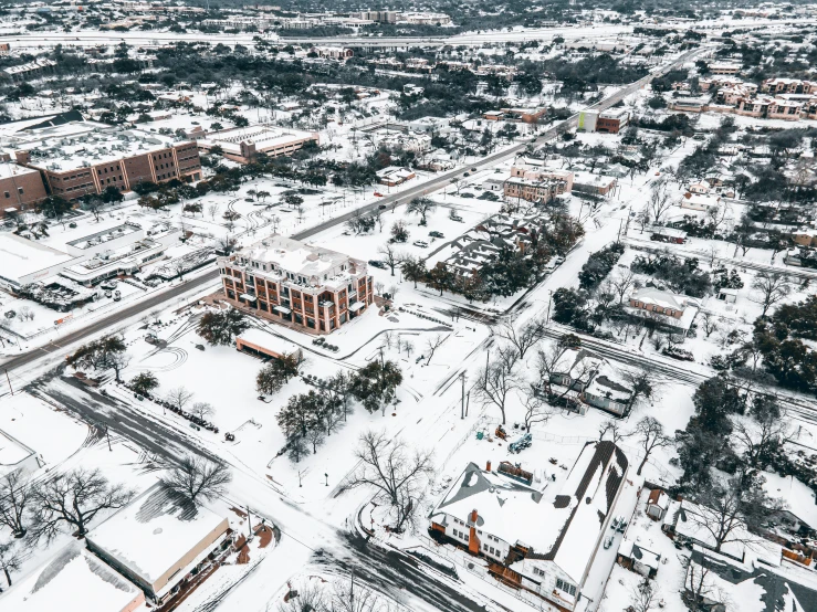 an aerial view of a large snowy city