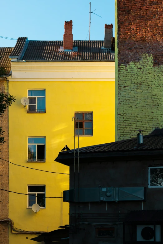 colorful buildings are reflected in a body of water