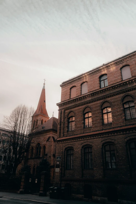 a church building in front of a clock tower