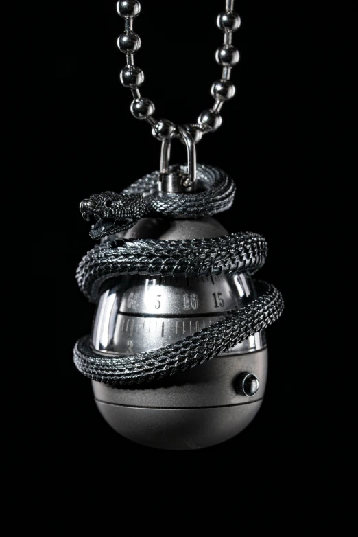 a necklace with some balls on top of it