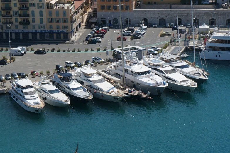 many boats are lined up beside each other in the harbor