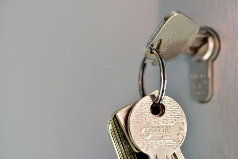 a small number padlock with some keys attached