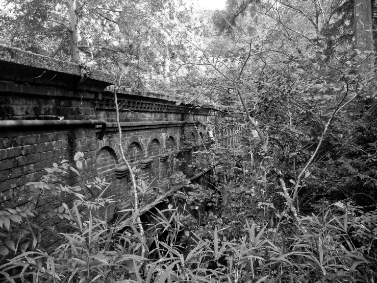 the view of a very tall brick bridge