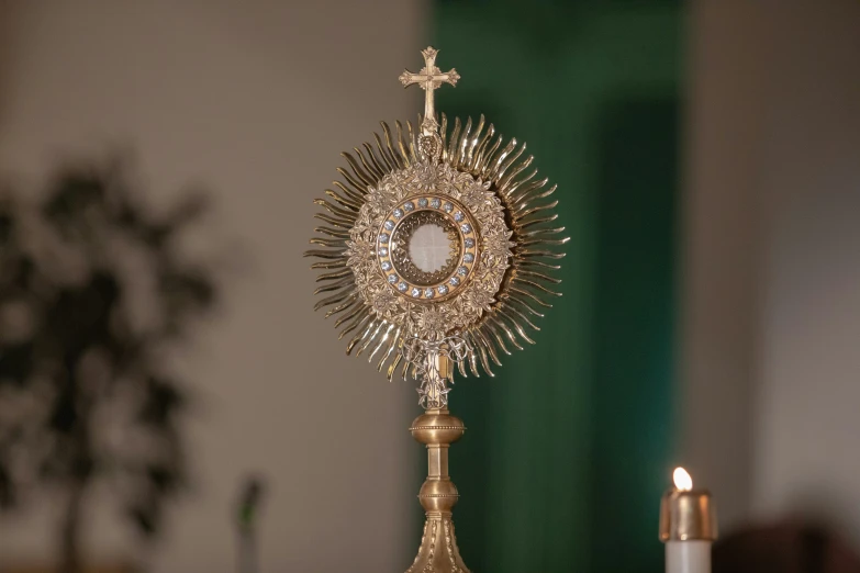 the alter is shown with several candles and a cross on it