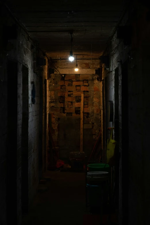 an empty corridor with several garbage containers