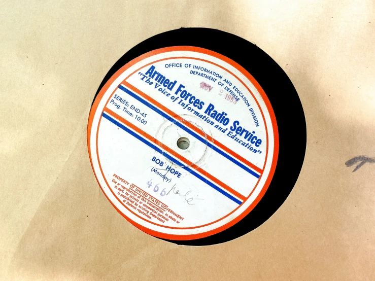 an orange and black record with words written on it
