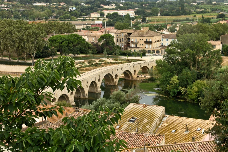 a river and village as seen from a hilltop