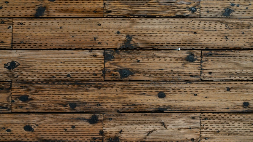 wood boards with some black spots on them