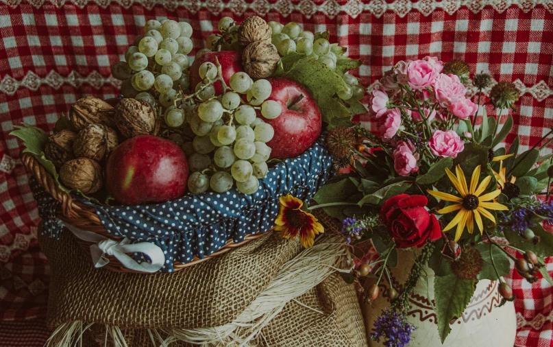 painting of fruit on red and white checkered background