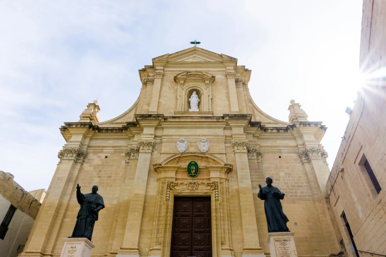 the building has statues on each side