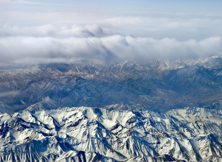 a very pretty mountain range under some clouds