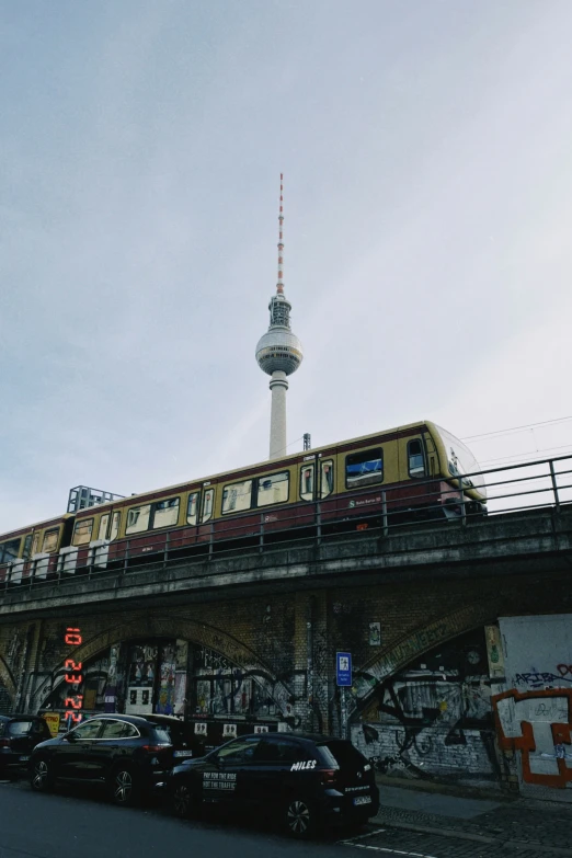 vehicles on the road in front of a train station