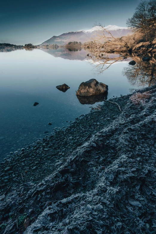 a view of the lake at night, from the shore