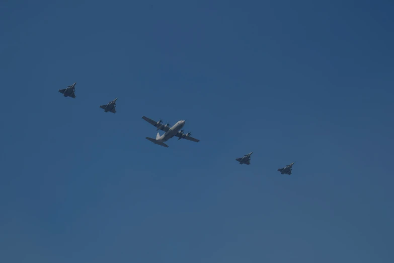 six jet planes flying in formation in the sky