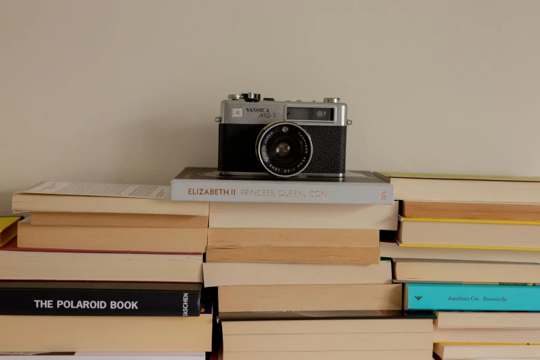 book stacked with camera on top of it