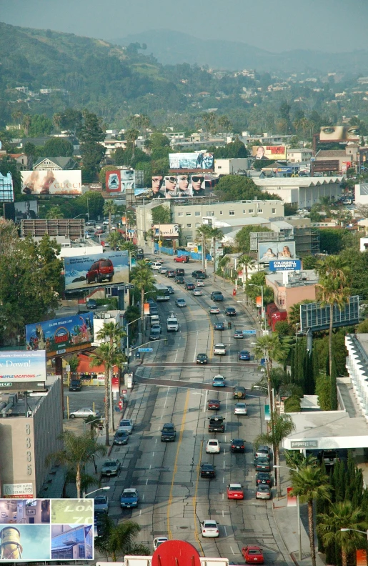 a street that has several cars traveling down it