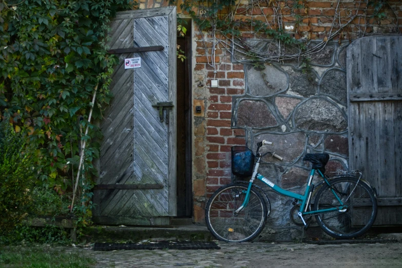 there is a bicycle leaning on a door