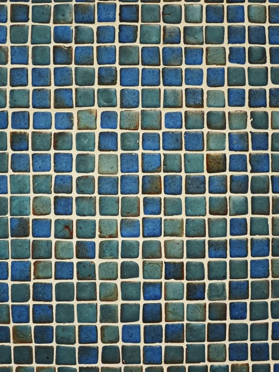 a blue tile pattern with small blocks and small squares