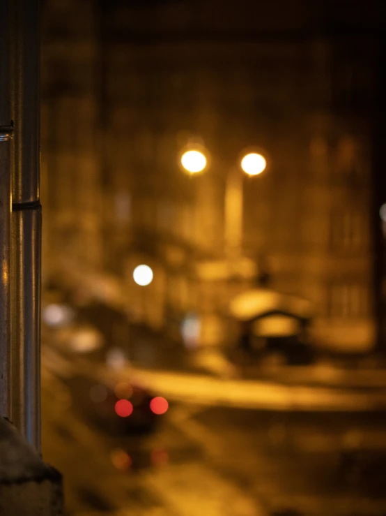 an blurry view from a window of traffic and street