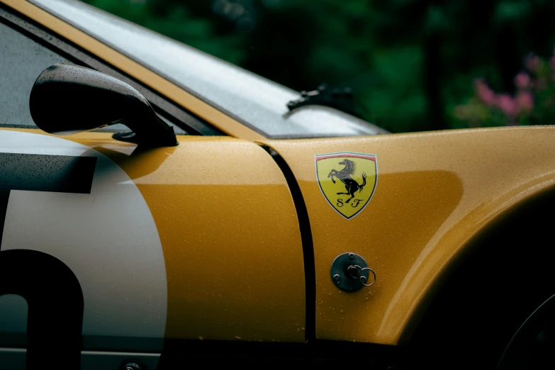 a yellow and white ferrari sports car parked