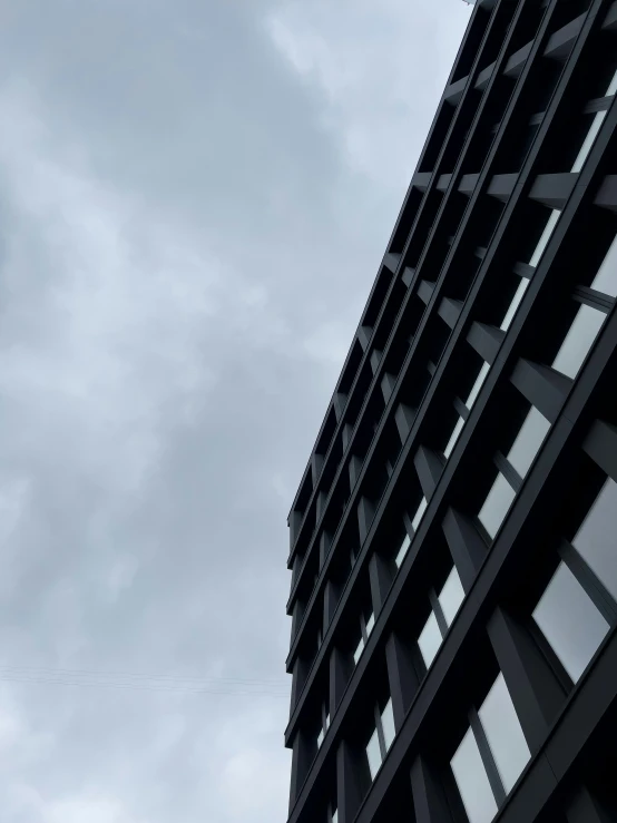 an airplane flies past a high rise building