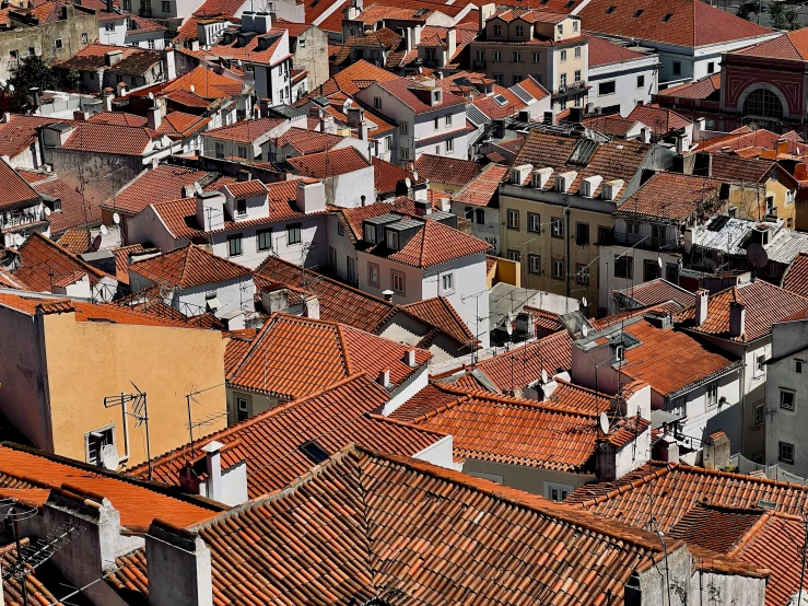 a city with lots of orange tiled roofs