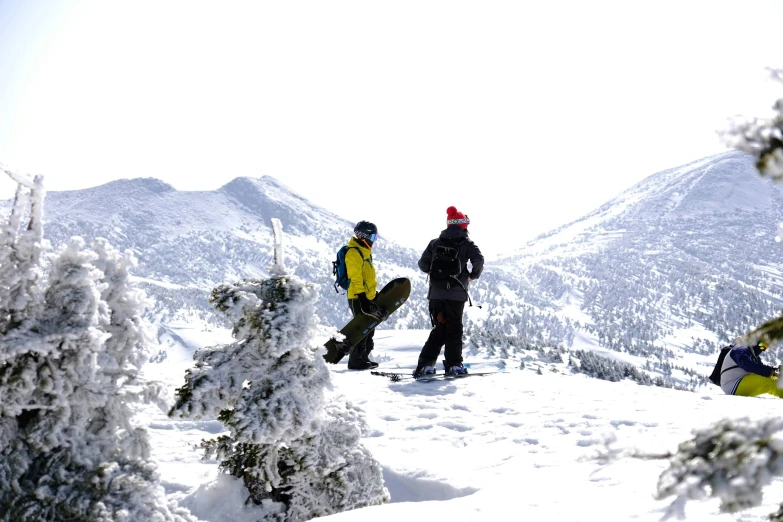 two people who are standing in the snow