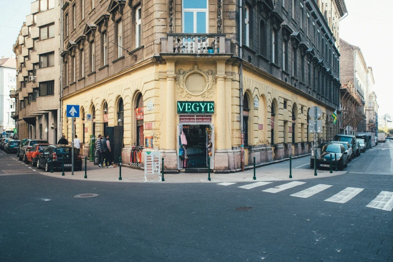 an old building is in the middle of the street