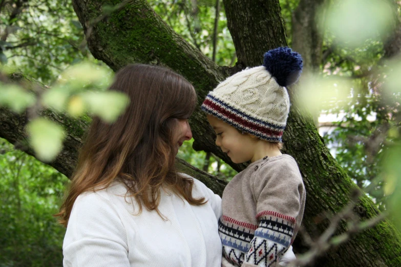 a mom and her son in the woods